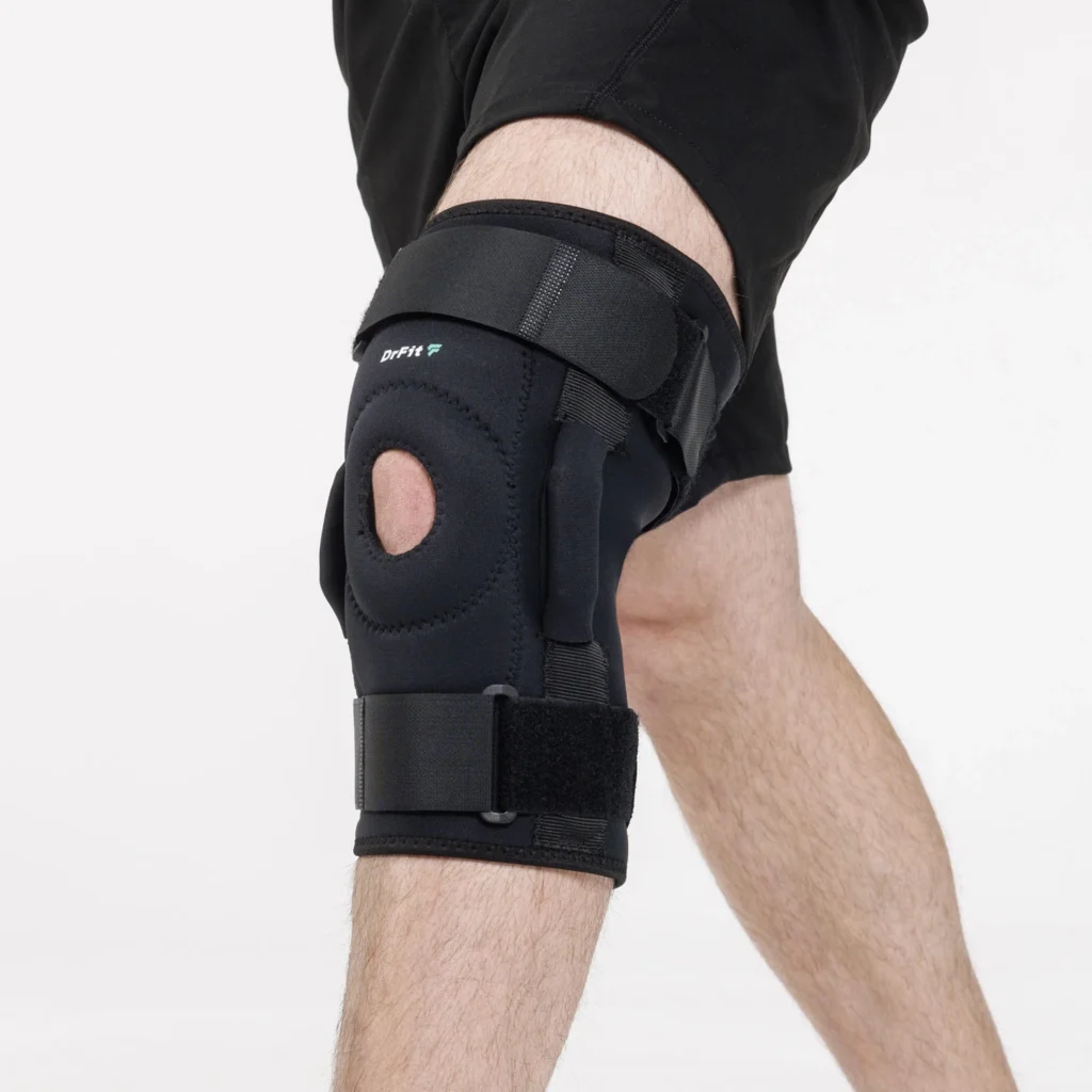 DrFit Zawiasowy stabilizator kolana z neoprenu z otworem na rzepkę